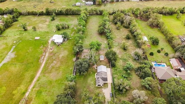 birds eye view of property featuring a rural view