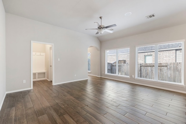 empty room featuring ceiling fan and dark wood-type flooring