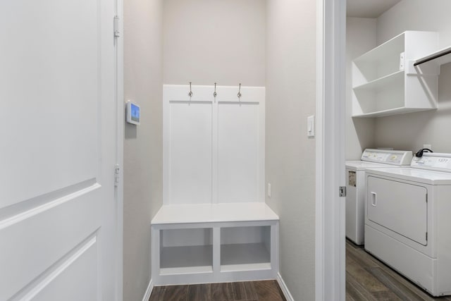 mudroom with dark hardwood / wood-style flooring and washing machine and clothes dryer