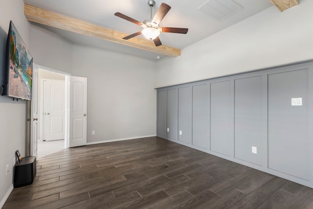 unfurnished bedroom featuring ceiling fan and dark wood-type flooring