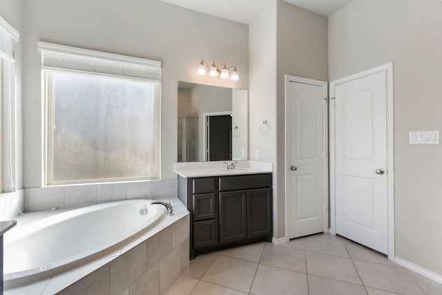 bathroom featuring tile patterned flooring, vanity, and independent shower and bath