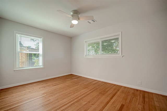 spare room featuring ceiling fan and light hardwood / wood-style flooring