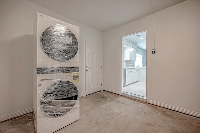 laundry room featuring stacked washer and dryer