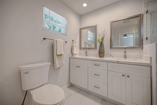 bathroom featuring toilet and vanity