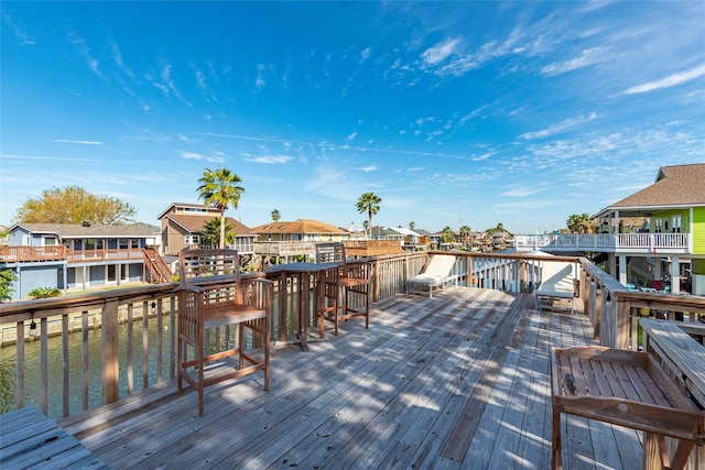 wooden deck with a water view