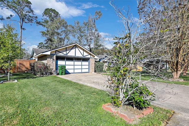 view of front of home featuring a front yard and a garage