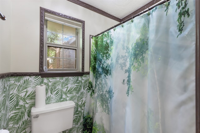 bathroom with a textured ceiling and toilet