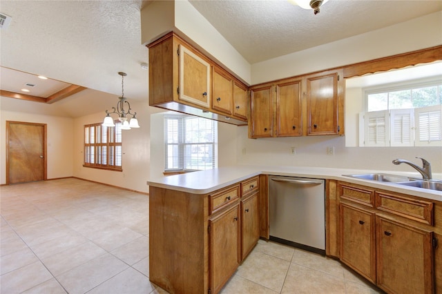 kitchen featuring pendant lighting, dishwasher, kitchen peninsula, and a textured ceiling