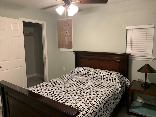 bedroom with ceiling fan and a closet