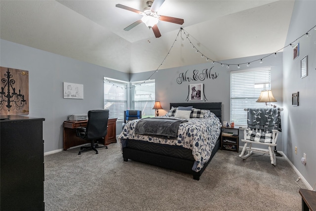 carpeted bedroom with multiple windows, ceiling fan, and vaulted ceiling