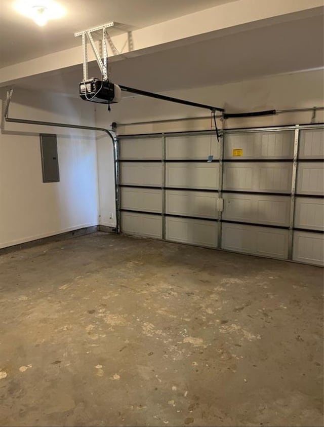 garage featuring electric panel and a garage door opener