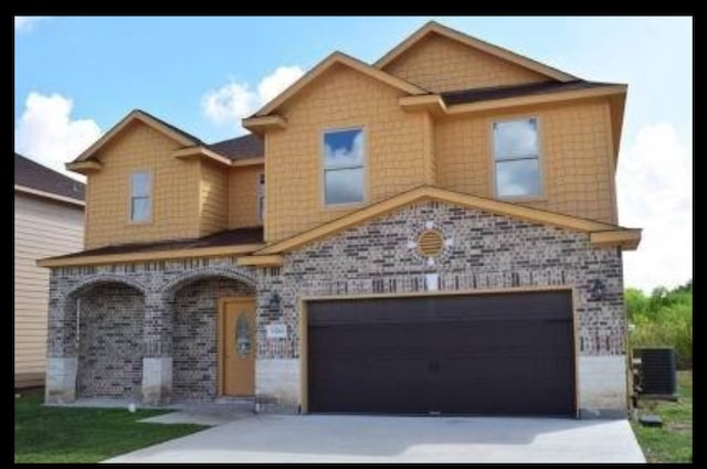 view of front facade with central AC and a garage