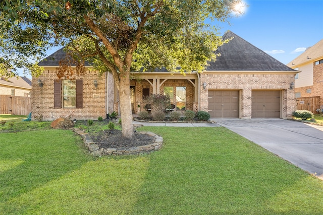 view of front facade with a garage and a front yard