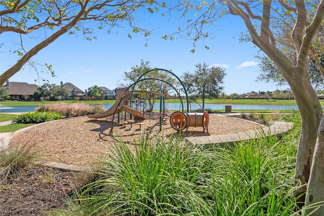 view of jungle gym featuring a water view