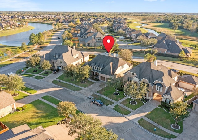 birds eye view of property featuring a water view