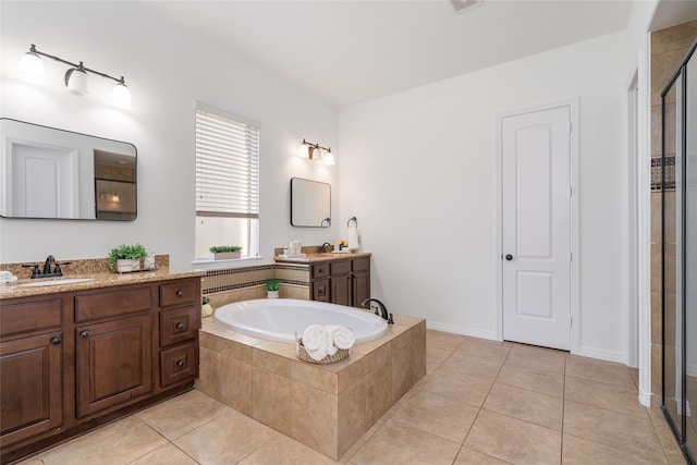 bathroom with separate shower and tub, tile patterned flooring, and vanity