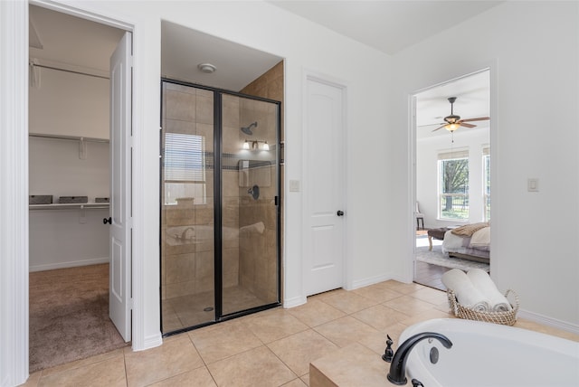 bathroom with tile patterned floors, ceiling fan, and independent shower and bath