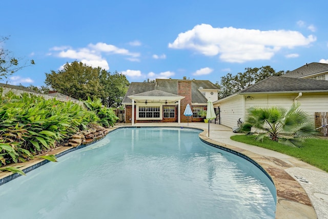 view of pool featuring ceiling fan