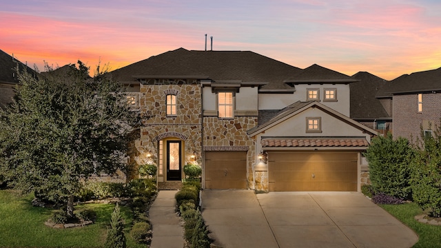 view of front of property featuring a garage