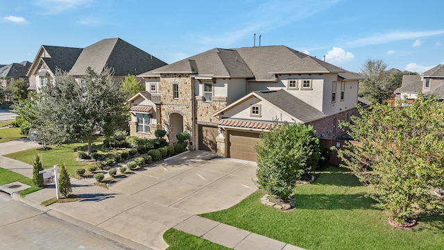 view of front facade with a front yard and a garage