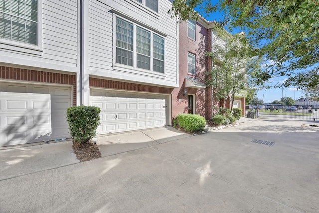 view of side of home featuring a garage