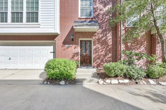 doorway to property featuring a garage