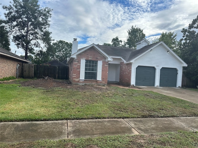 view of front facade with a garage and a front yard