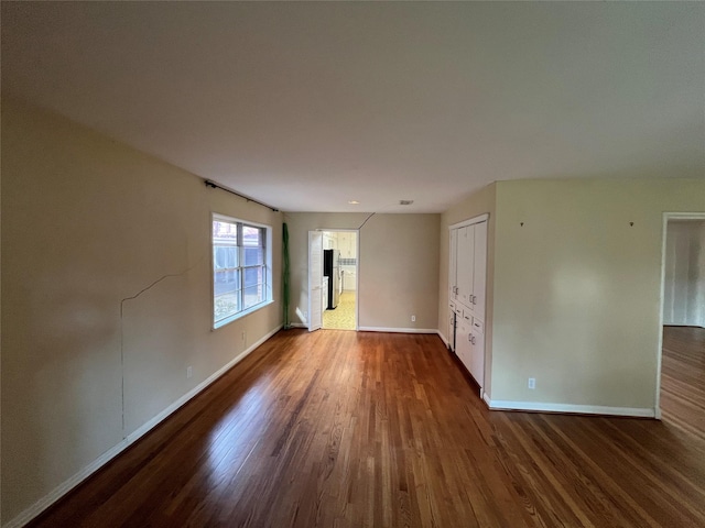 empty room featuring dark hardwood / wood-style floors