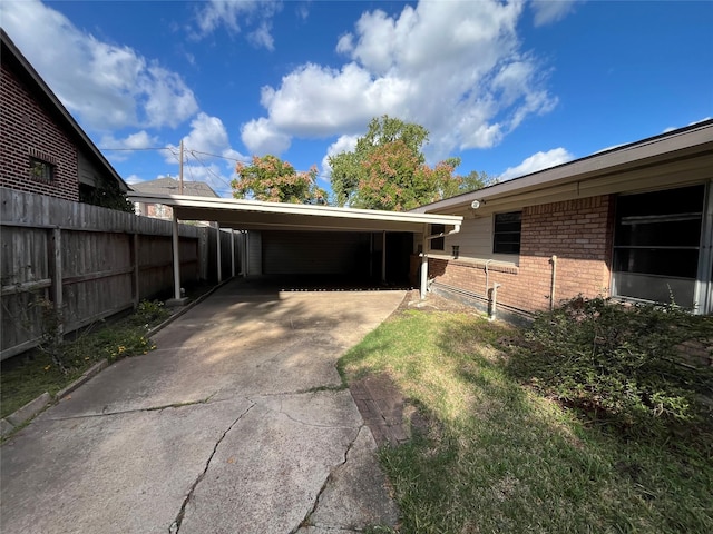 view of side of property featuring a carport