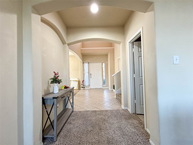 hallway featuring light carpet