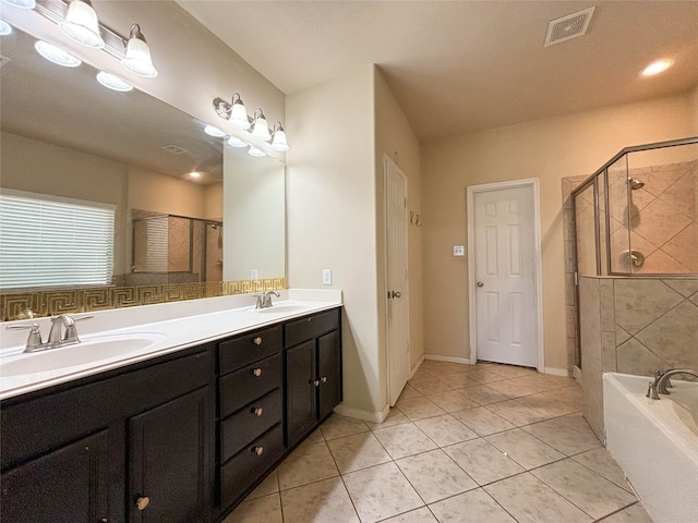 bathroom with vanity, tile patterned floors, and separate shower and tub