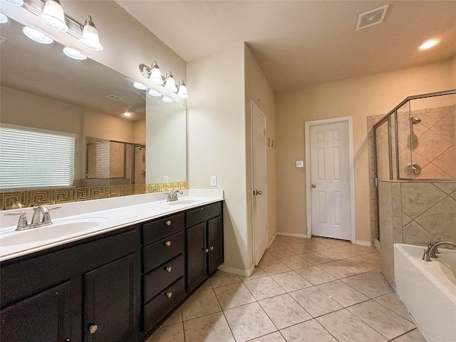 bathroom with vanity, tile patterned floors, and shower with separate bathtub