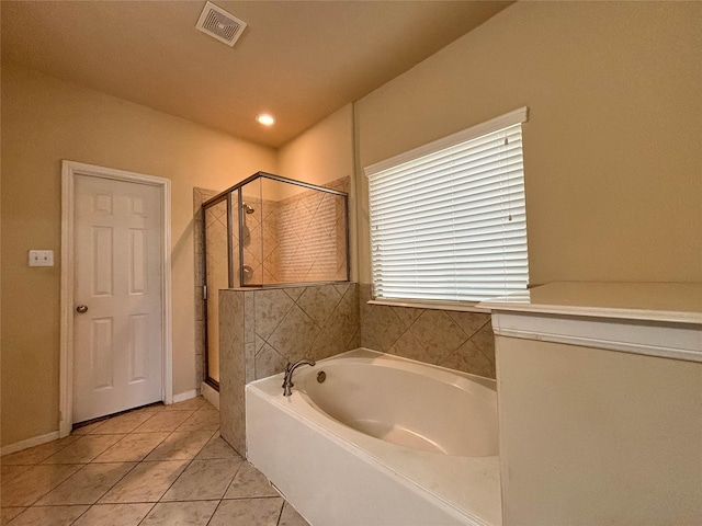 bathroom with tile patterned floors and plus walk in shower