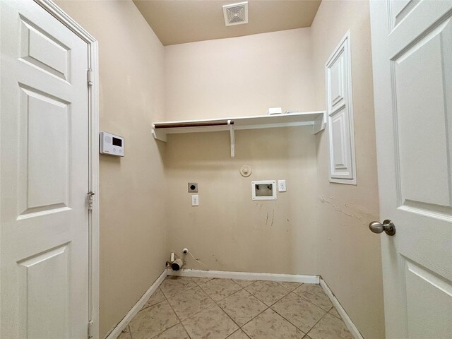 laundry room with hookup for an electric dryer, light tile patterned flooring, gas dryer hookup, and hookup for a washing machine