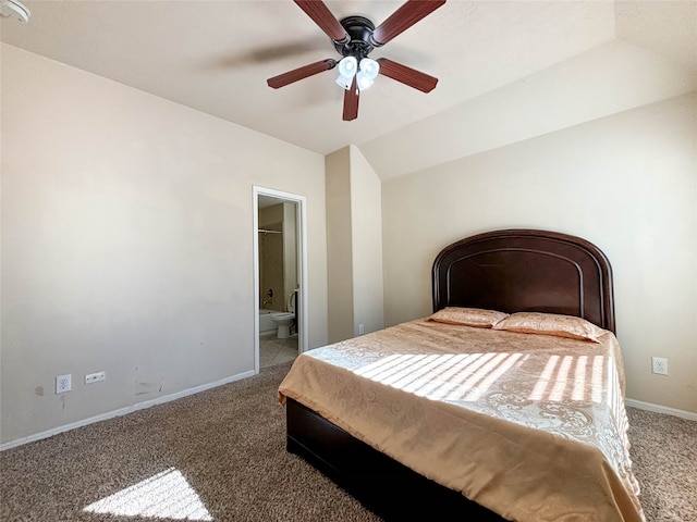 carpeted bedroom featuring ceiling fan, connected bathroom, and vaulted ceiling