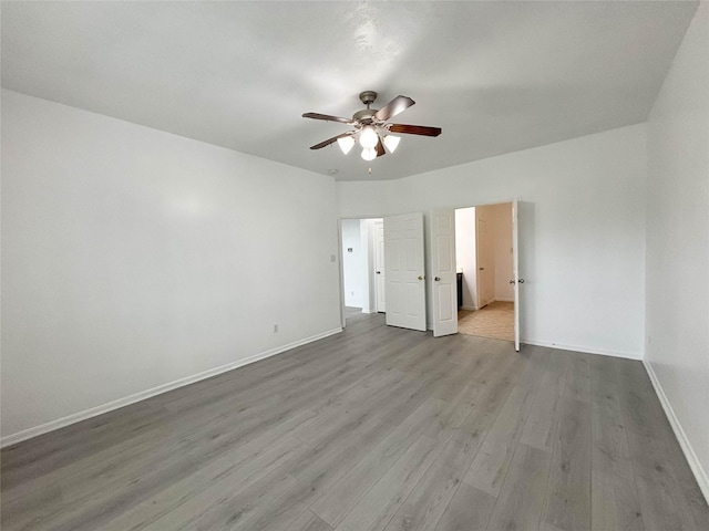 unfurnished bedroom with ceiling fan and light hardwood / wood-style floors