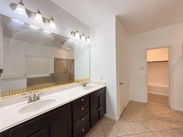 bathroom with vanity, tile patterned floors, and walk in shower