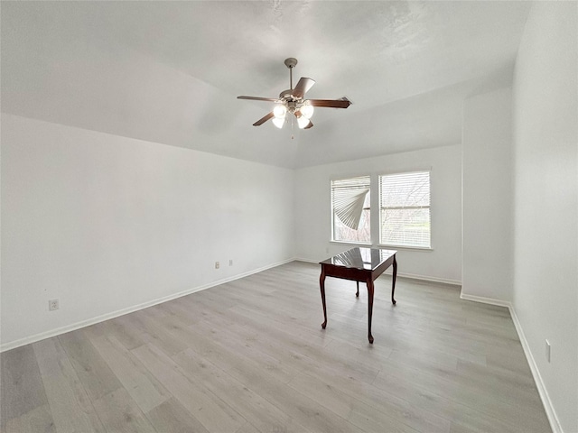 spare room featuring ceiling fan, vaulted ceiling, and light hardwood / wood-style flooring