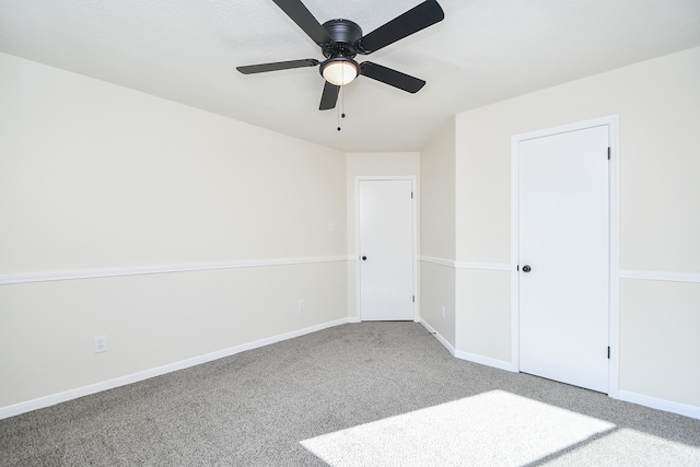 unfurnished bedroom with carpet flooring and ceiling fan