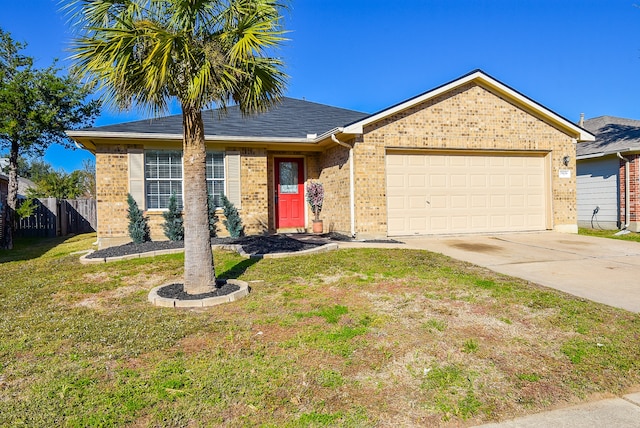 ranch-style home with a garage and a front lawn