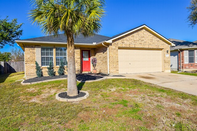 ranch-style house with a garage and a front lawn