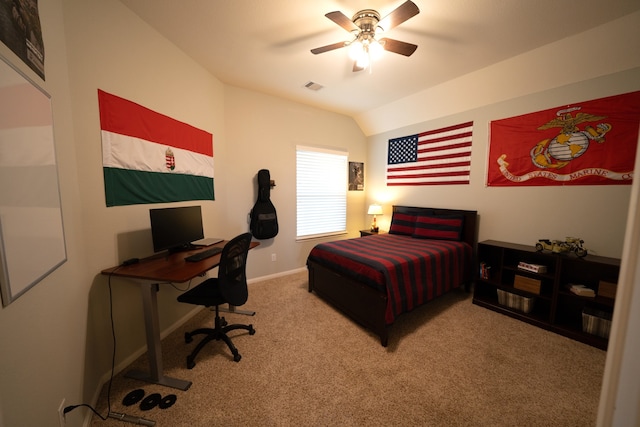 carpeted bedroom with ceiling fan and vaulted ceiling