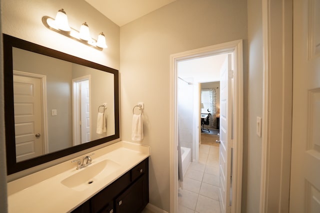 bathroom with tile patterned flooring and vanity