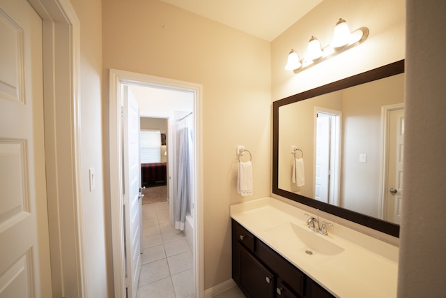 bathroom with vanity, tile patterned floors, and curtained shower