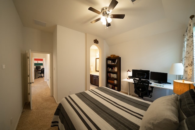 bedroom with ceiling fan, light colored carpet, and vaulted ceiling