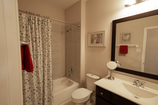 full bathroom with vanity, shower / bath combo, and toilet