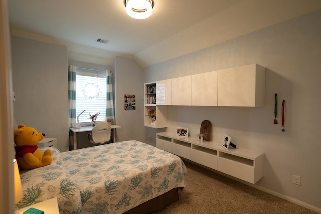 carpeted bedroom featuring lofted ceiling