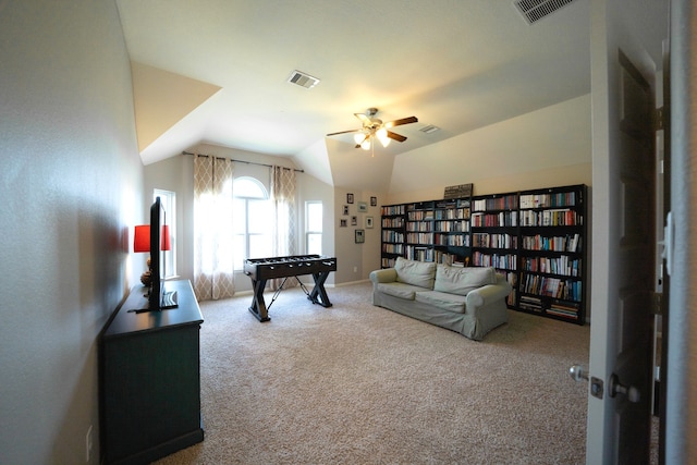 game room with carpet flooring, ceiling fan, and lofted ceiling