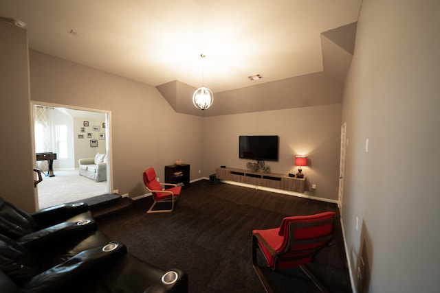 carpeted living room featuring vaulted ceiling