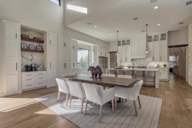 dining room featuring a wealth of natural light and light wood-type flooring